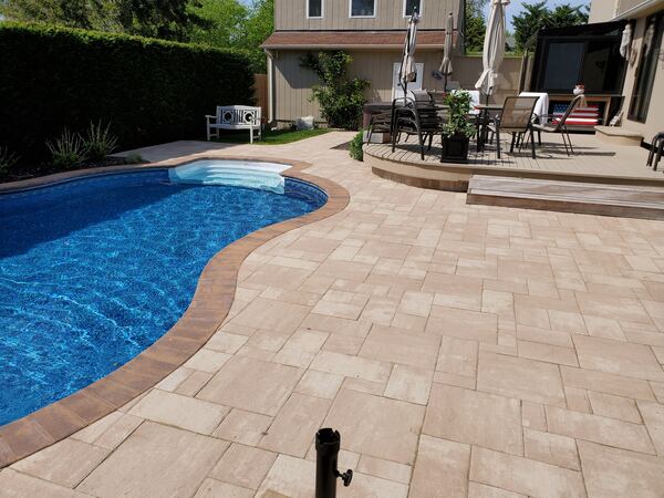 Pool patio with lounge area and stone accents