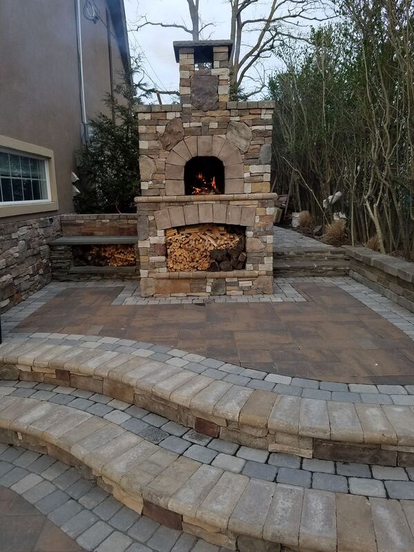 Stone pillar and wall construction with veneer detail